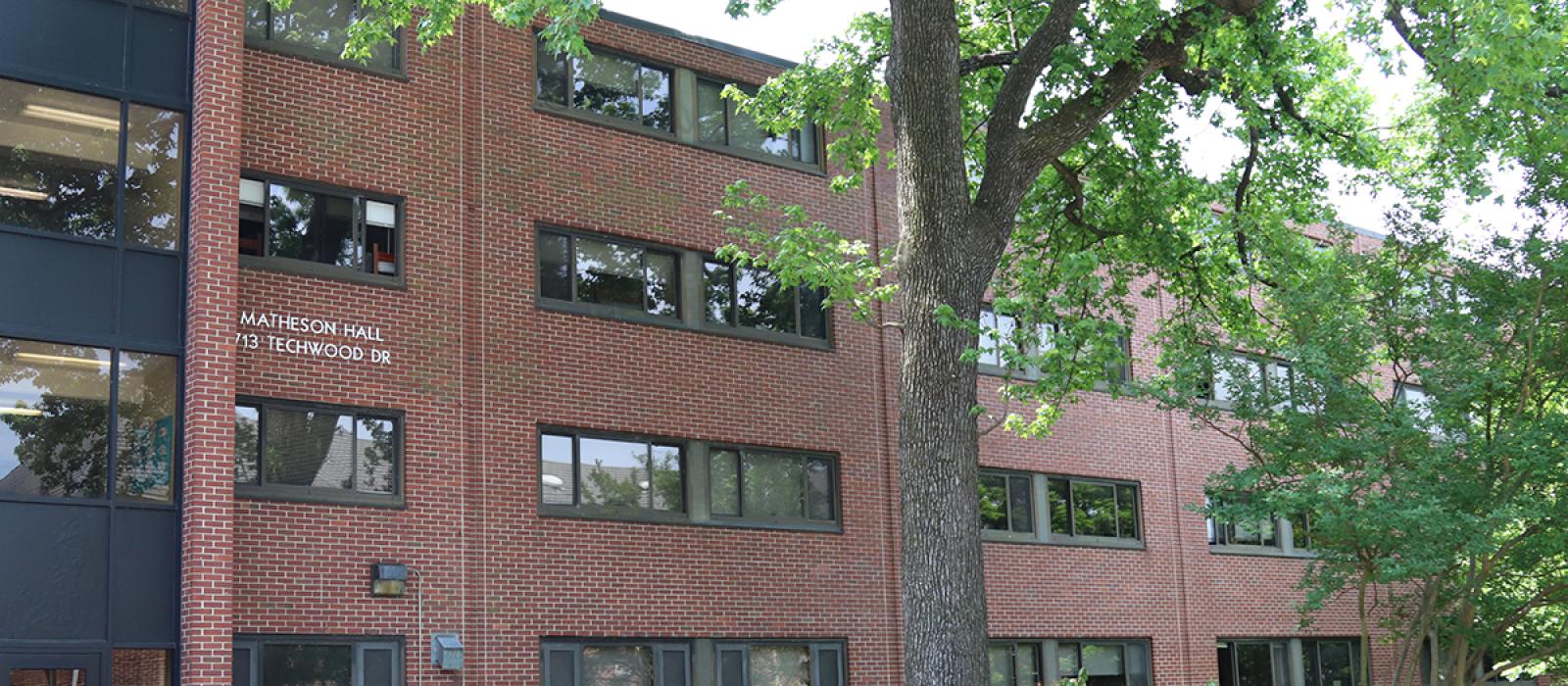 Matheson building with trees in front.