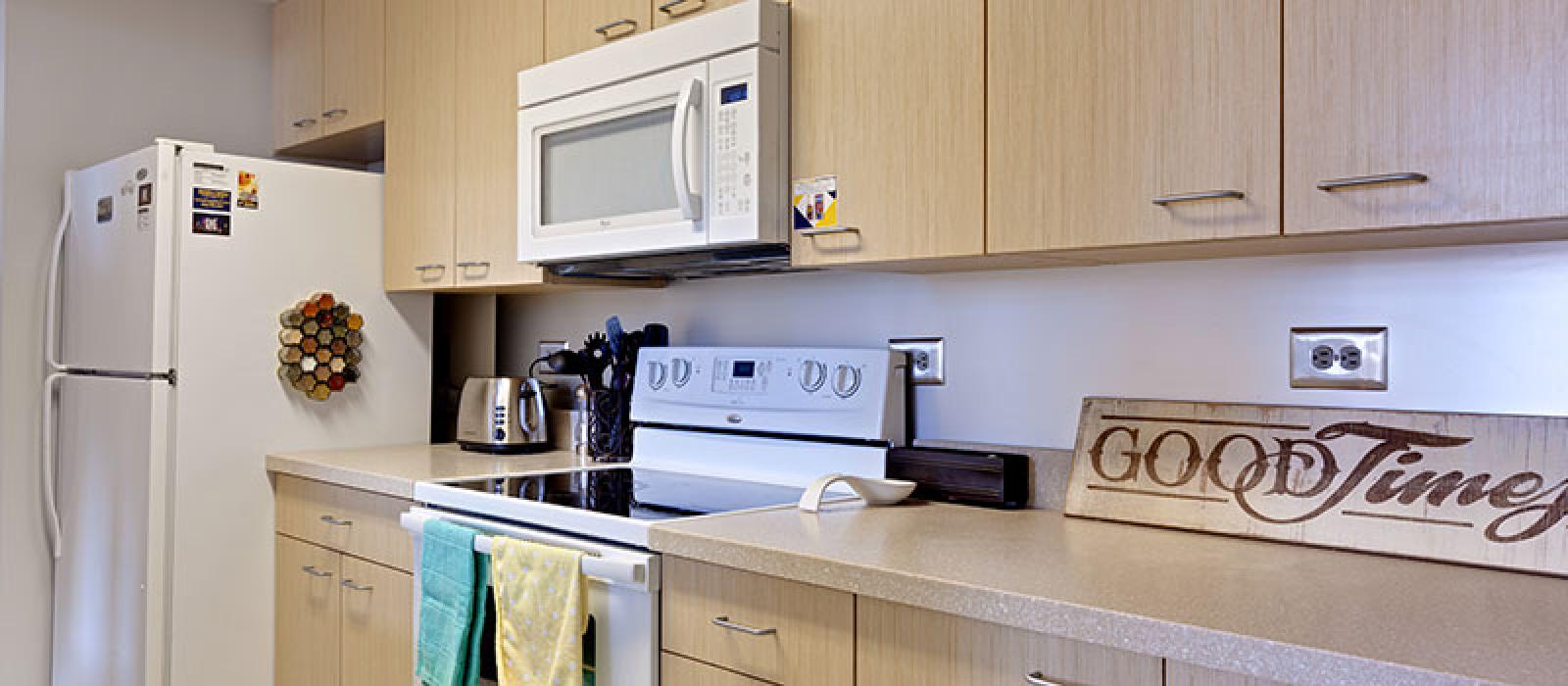 Kitchen with a sign that reads "Good Times"