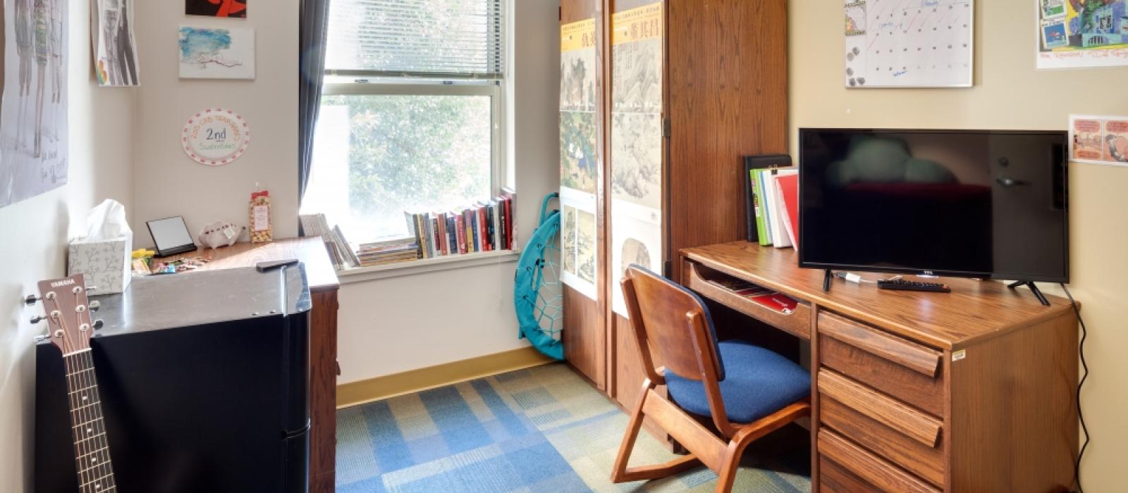 Furnished and decorated by a student bedroom.