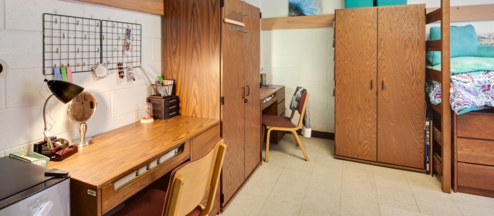 Bedroom suite with beds, wardrobes and desks.