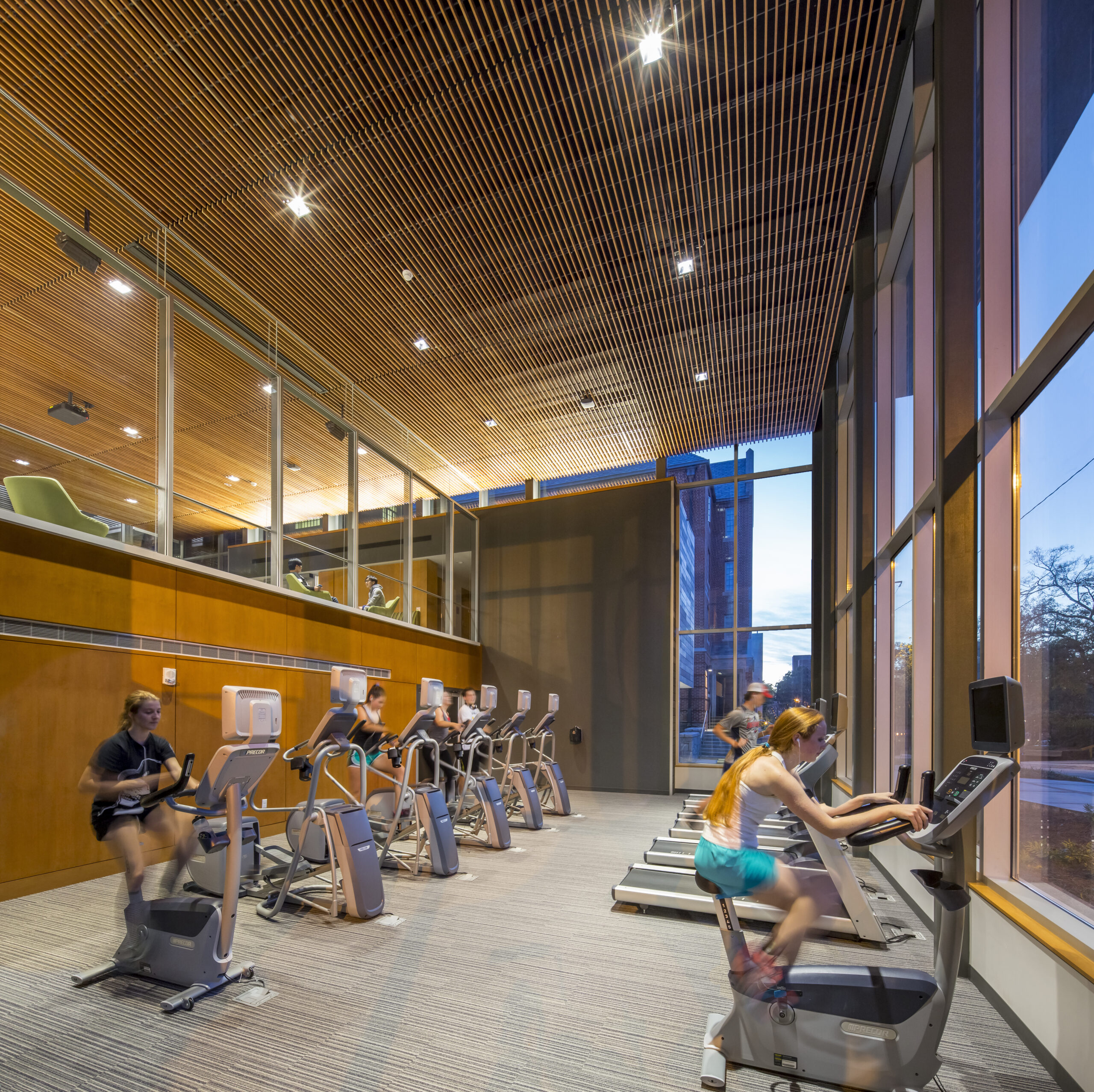 Students working out on treadmills and ellipticals in the Georgia Tech Connector